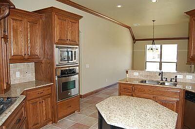 Kitchen opens to breakfast nook.