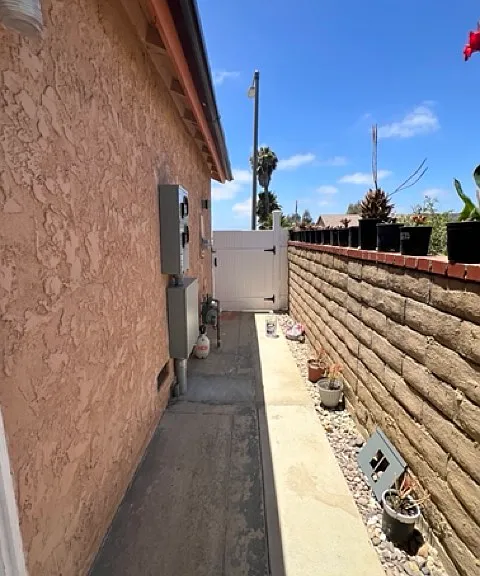 Side entrance view going to street from gate.