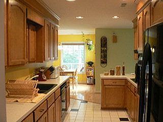 kitchen with all new appliances and ceramic tiles
