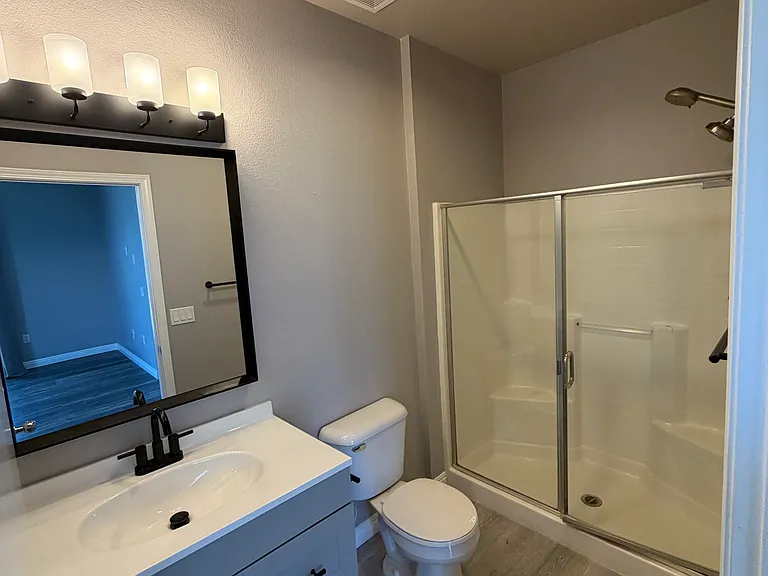Stylishly renovated primary bathroom.