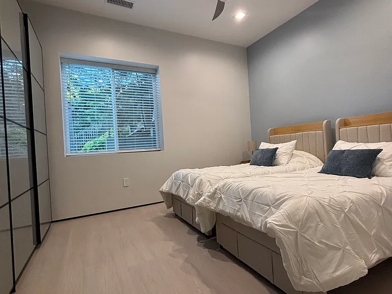 Master bedroom with 2 twin XL beds or 1 king bed, 126" long organized closet