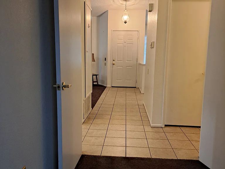 View from second bedroom to front door.