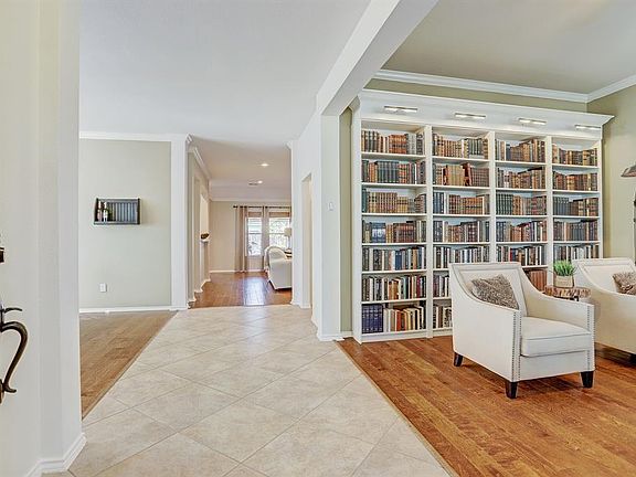 Spacious and open entryway. Beautiful hardwood floors as seen throughout the living area.