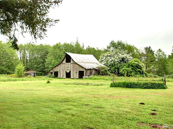 Beautiful old rustic barn charms this rural property