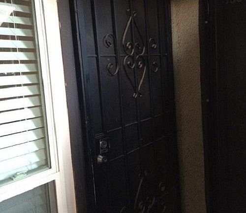 Front door has metal security screen door