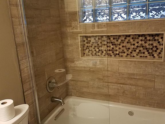 spacious bathroom with bubble massage air tub/shower comfort height toilet