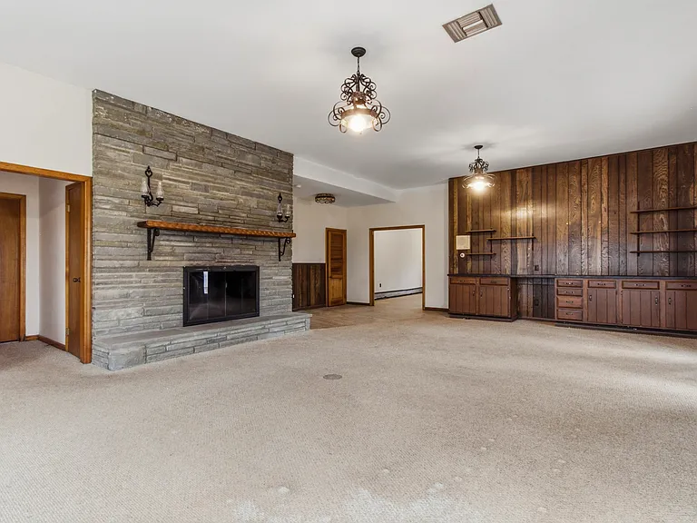 Family room w/ wood burning fireplace