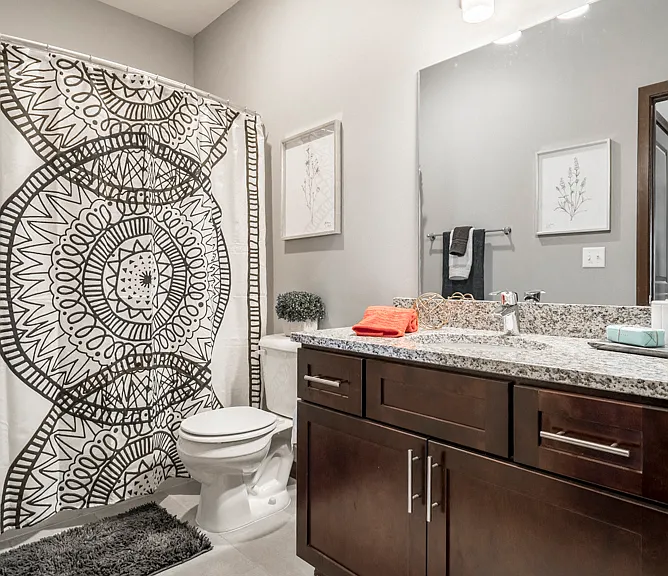 Our bathrooms feature tile floors, sleek hardware and granite countertops.