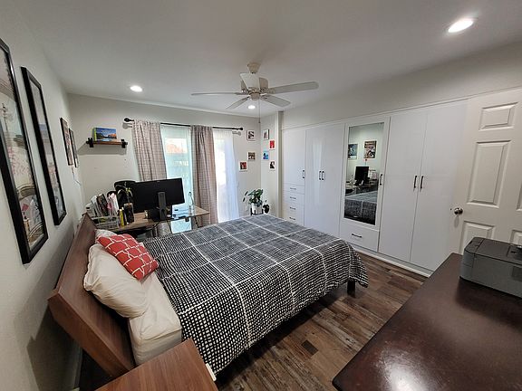 Master bedroom with luxury custom closets made by California closets.