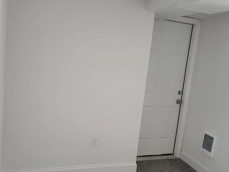 door in bedroom that leads to laundry