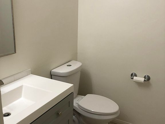 New bathroom vanity and toilet in powder room