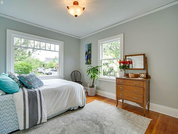 Main bedroom on corner with wonderful light - but with blackout blinds installed for when it needs to be dark