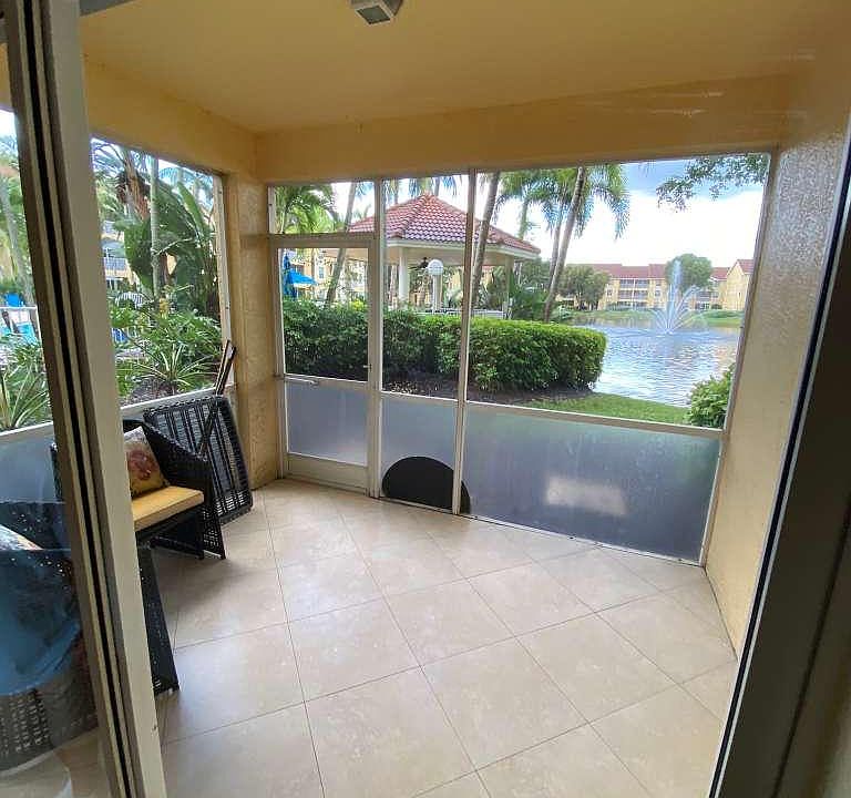 tiled lanai overlooking pond with lower privacy panels to help keep dirt out. Just steps away from community pool!