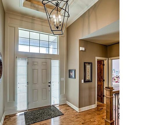 This home has upgrades lighting and gleaming wood floors