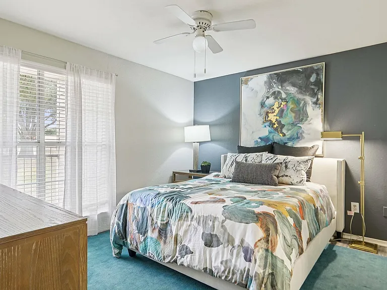 Enjoy a comfortable and spacious bedroom with bright natural light at Oak Forest in Lewisville.