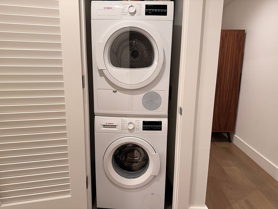 Bosch Washer and Dryer inside unit.
Door closes to keep out of sight.
Utility closet across the hallway for additional storage.