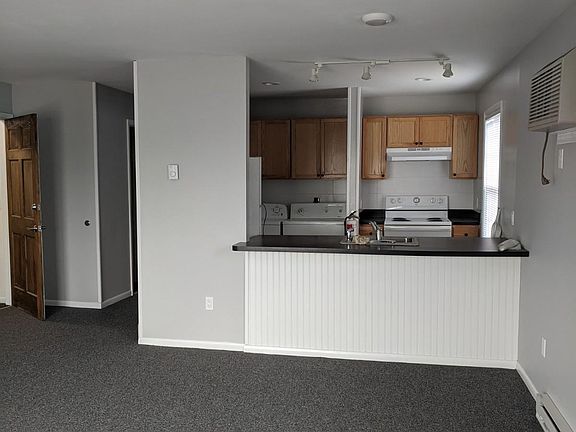 kitchen and entry door on left from living room