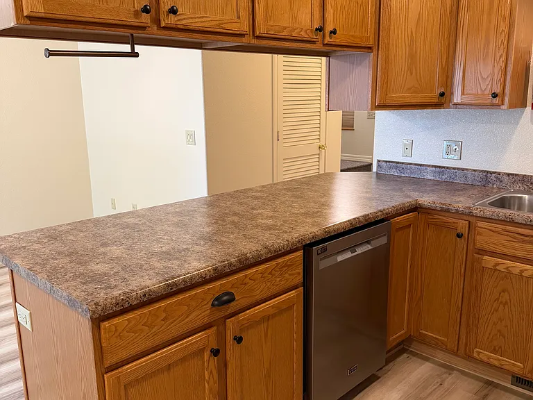 Kitchen, with new appliances, new sink, new faucet.