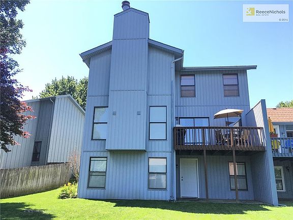 Back Of Home View. Beautiful Grand Exterior Presence. Features: $5k New Adjoining Siding, Private Deck, Covered Patio, Full Unfinished Walk-Out Basement, And Lush Open Backyard.