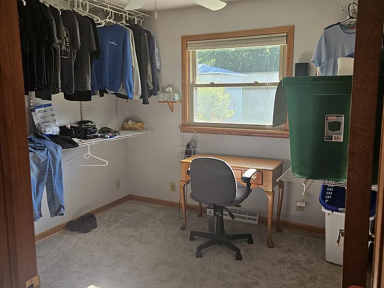 BDR #3 main floor- currently being used as a office and a laundry room. Additional laundry room down stairs.