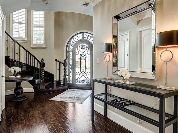 Large entry hall with coat closet and high ceilings