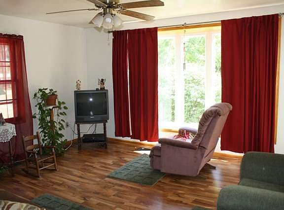 Walk into adorable living room with bay window