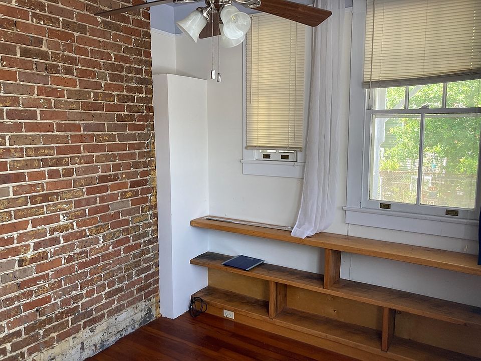 Study/office/studio/nursery with built-in shelving and lots of windows