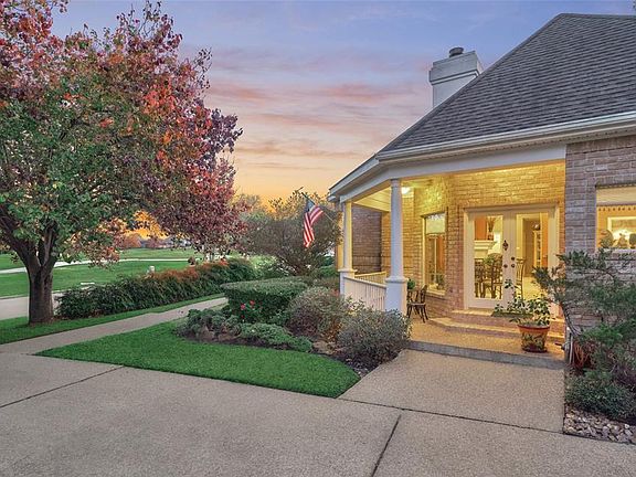 Attractive front porch overlooking the serene golf course.