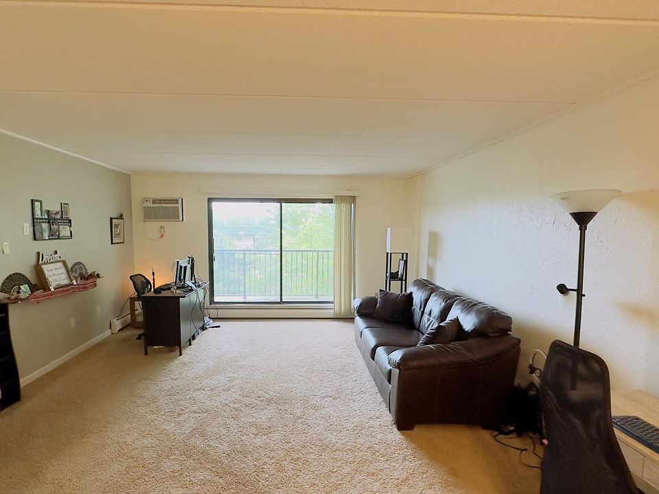 Large living room, plenty of sunlight.