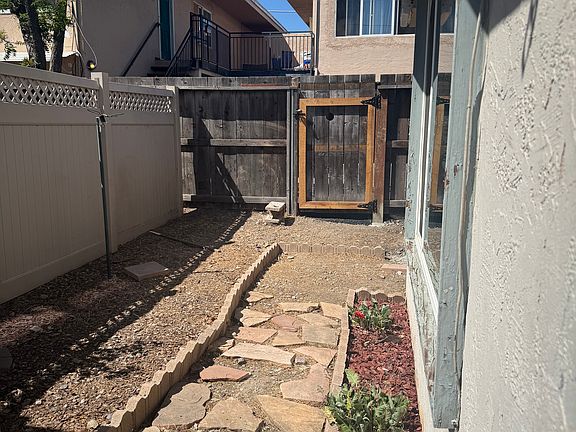 Garden area in front of unit. This private space can be used for plants or as a sitting area with a small table and chairs