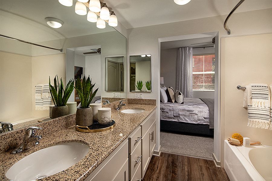Bathrooms feature soaking bathtubs, granite countertops and luxury vinyl plank flooring