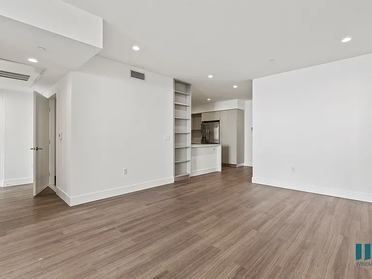Dining Room Area with Built-In Shelving, Vinyl Flooring, and Recessed Lighting