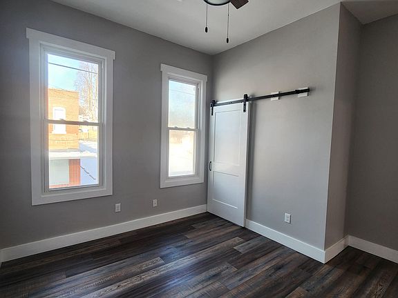Closet wall with space saving barn door