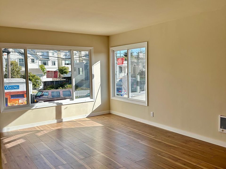 Bright and sunny living space with oversized windows. Can be used as living/dining are. New floors and new paint!