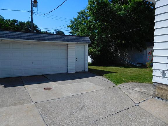 Two cars garage and backyard
