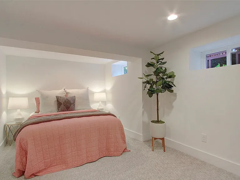 West bedroom (Furnishings not included). Window by bed has been enlarged-- see unfurnished image.