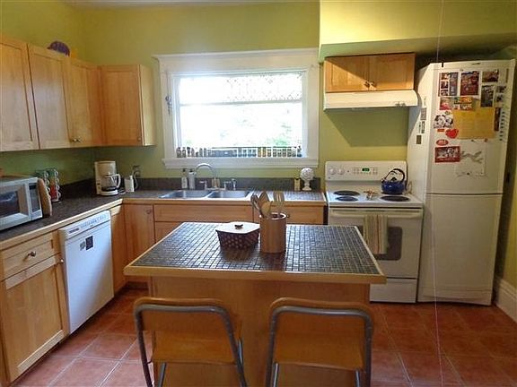 Updated kitchen with plenty of cubboard and counter space.