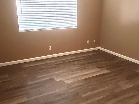 Bedroom 1: New floors, paint, blinds & ceiling fan