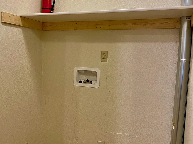 laundry area off living room/kitchen, electric washer/ gas dryer hookup