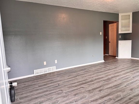 Living Room with with BRAND NEW LVT wood plank flooring.