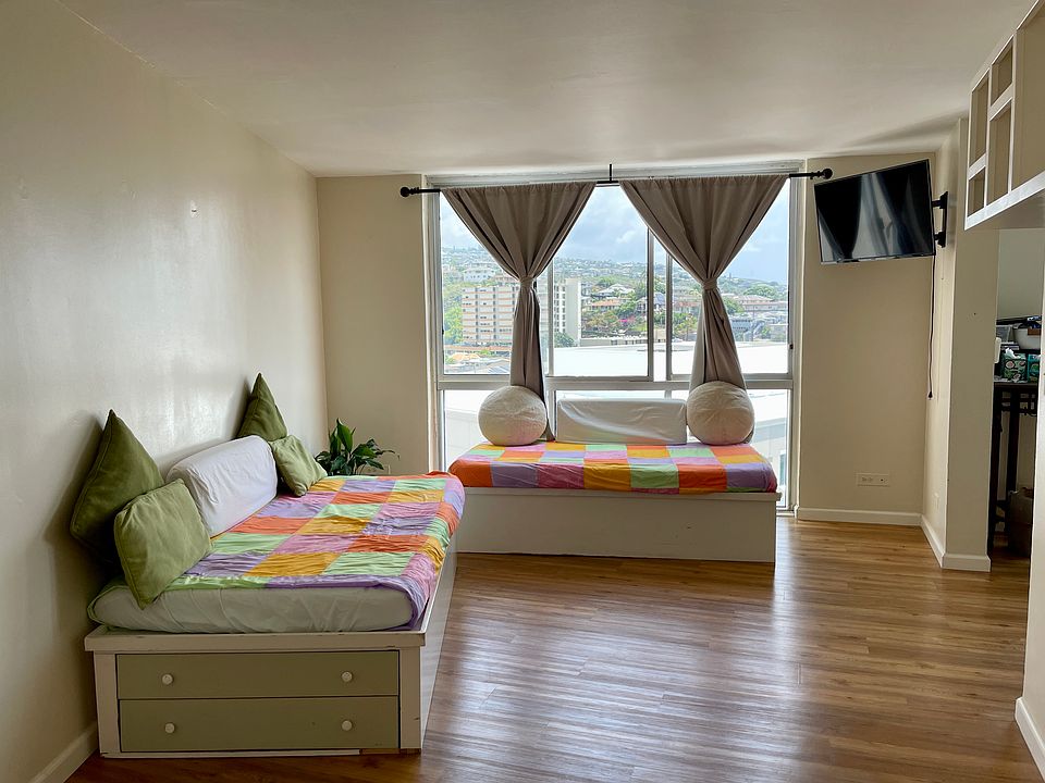 Living Room - view from front door entry. (Bed NOT included in the rental, but for size reference, these are twin sized daybeds)
