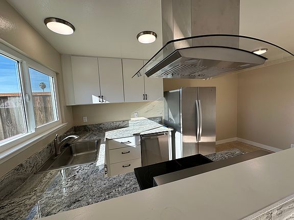 Free standing range hood has button controls & gesture controls