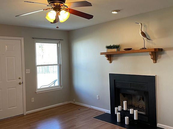 Spacious living room with Pergo flooring and lovely neutral gray color palette