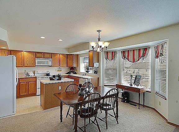 Light & bright eat-in nook with bay window.
