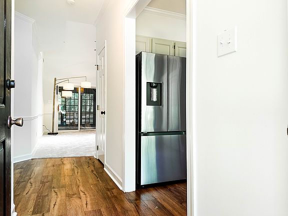 Foyer with view into the kitchen, living room