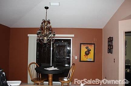 Dining room
						:
						A glass flower chandelier accents the dining area.