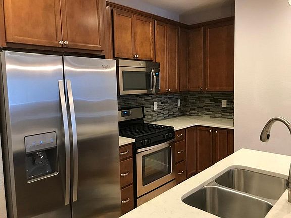 Stainless steel appliances, gas stove and oven.