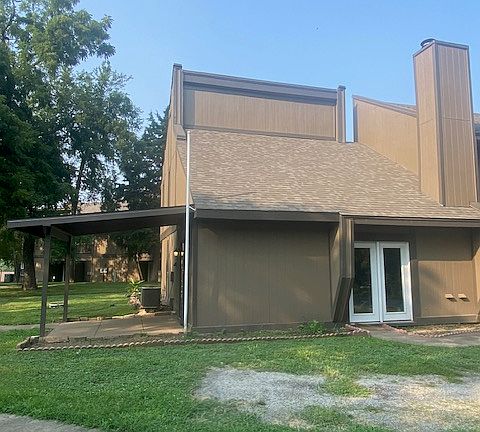 Side view of covered back patio and front door