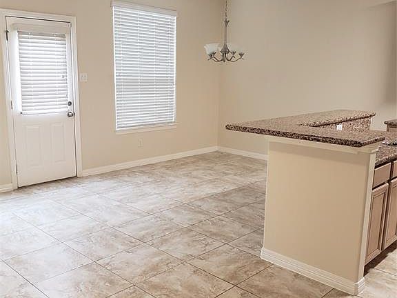 Breakfast bar open to the dining and living rooms