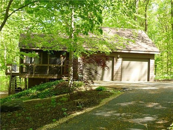 Attached two car garage with circle drive